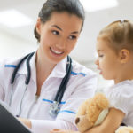 Doctor examining a child-wiz wordpress theme-clinic demo